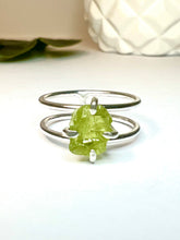 Load image into Gallery viewer, Look amazing with this double band ring featuring a stunning peridot stone. The unique 8-10mm stones allows for a comfortable fit on any finger. Perfect for everyday wear or special occasions, make this beautiful piece of jewelry yours today!