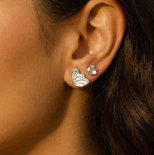 Load image into Gallery viewer, Close-up of an ear wearing butterfly-shaped earrings with a blurred background