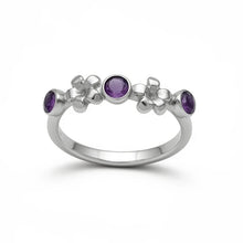 Load image into Gallery viewer, Silver ring with purple gemstones on a white background