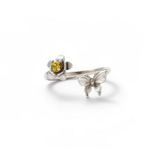 Load image into Gallery viewer, Silver ring with a yellow gemstone and butterfly design on a white background