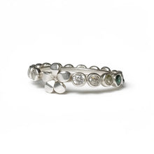 Load image into Gallery viewer, Silver ring with embedded stones on a white background