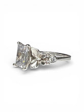 Load image into Gallery viewer, Silver ring with a large diamond and smaller gemstones on a white background