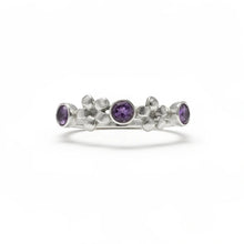 Load image into Gallery viewer, Silver ring with purple gemstones on a white background